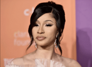 Close-up of Cardi B's courtroom look with bold accessories