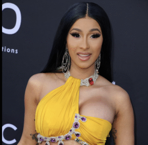 Cardi B walking into courtroom wearing stylish designer outfit